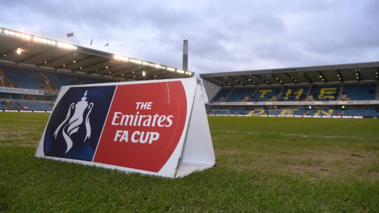 A photo of The Den stadium home of Millwall Football Club with an FA Cup sign visible